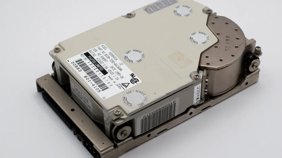 An old computer hard drive, showcasing vintage technology and retro hardware design.