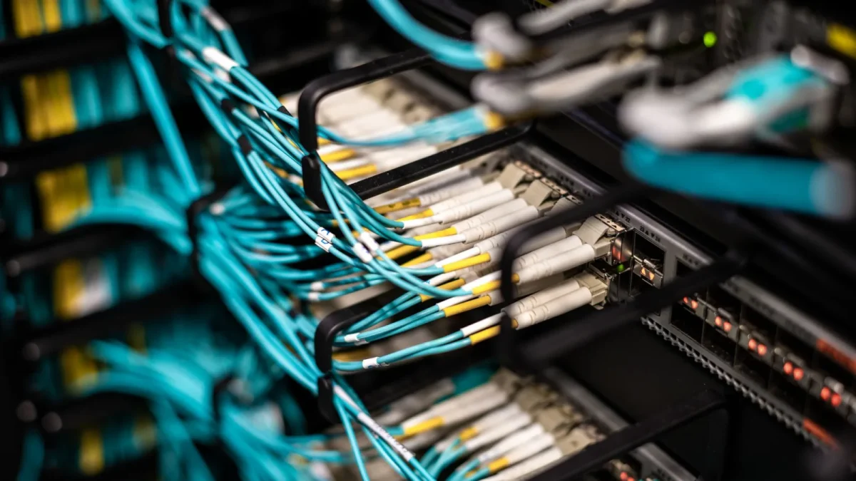 Numerous wires and cables mounted into server patch panel in modern data center