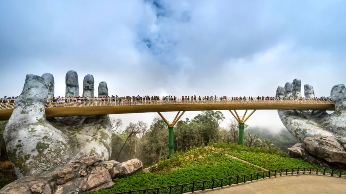 Golden Bridge in Da Nang held by giant stone hands, a popular tourist attraction.