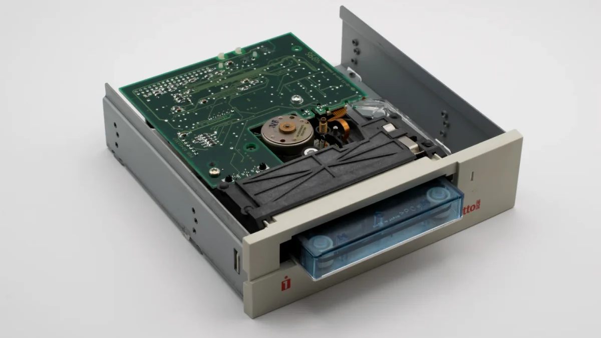 Close-up of a vintage internal Zip disk drive showcasing electronic components.