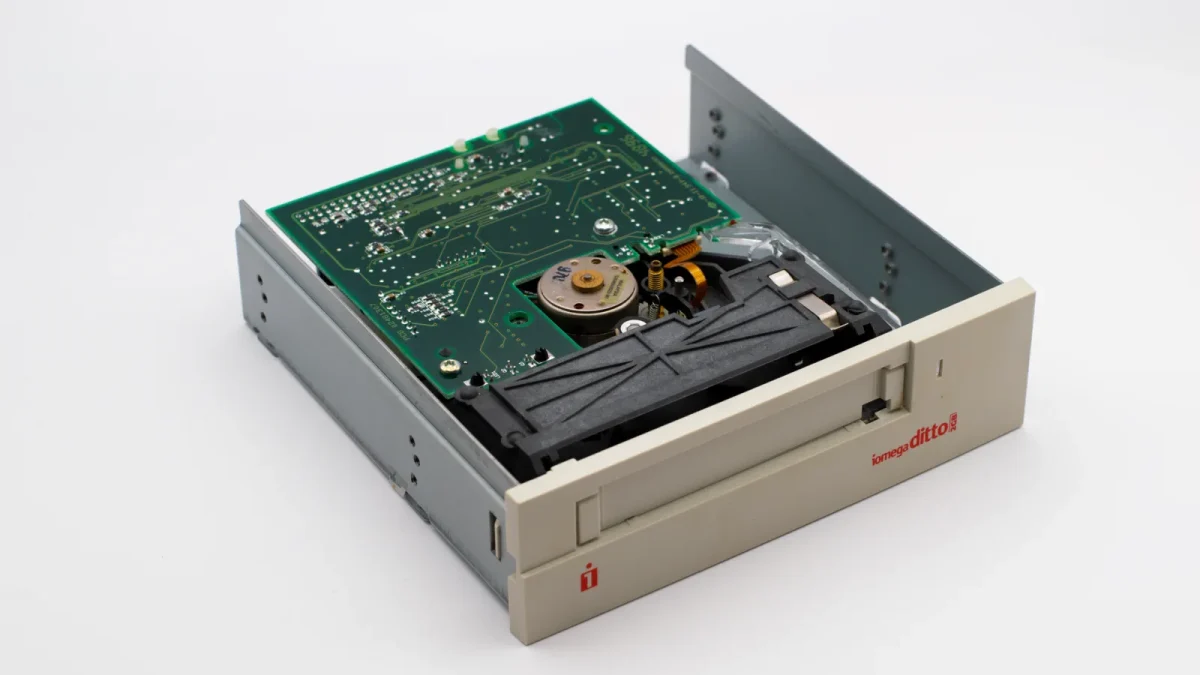 Close-up of a vintage Iomega Ditto internal tape drive with circuit board exposure.