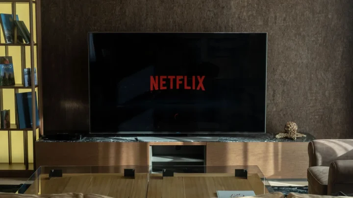 Cozy living room featuring a large TV displaying Netflix, perfect for entertainment.