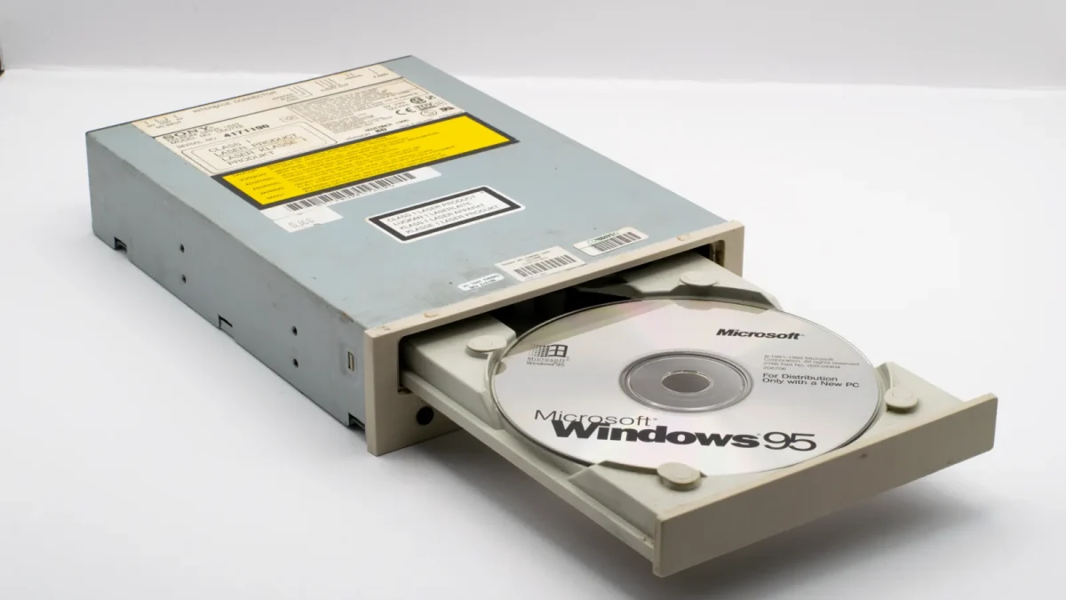 Vintage CD-ROM drive featuring Microsoft Windows 95 installation CD, a blast from the computing past.