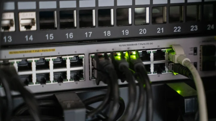 Networking equipment with connected cables, showcasing modern technology infrastructure.