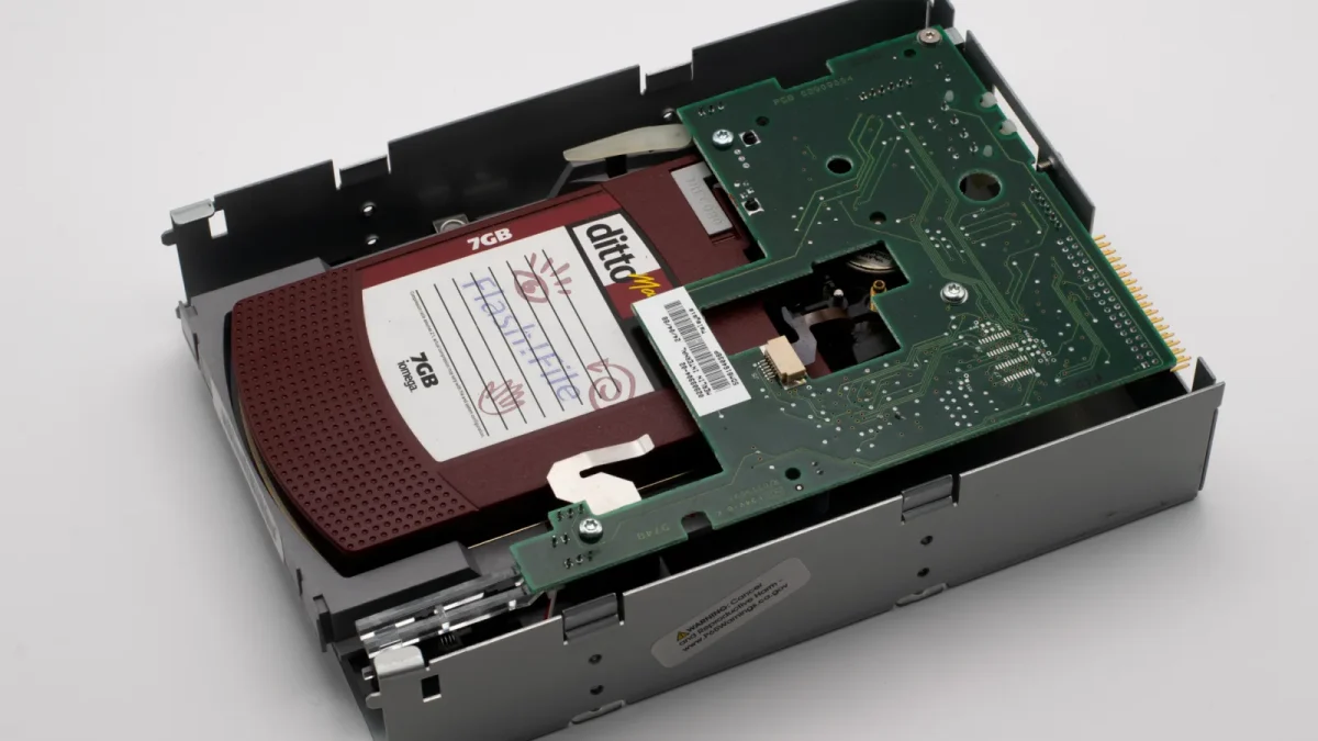 Close-up of a vintage 7GB storage drive showing intricate circuit design.
