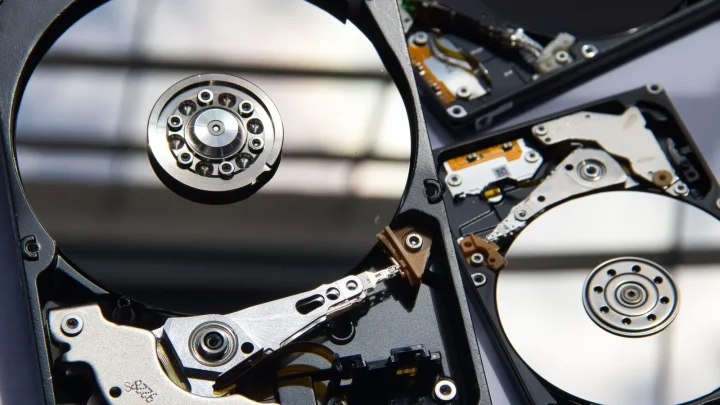 Detailed view of disassembled hard drives showcasing technology and hardware components.