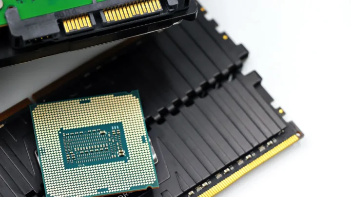 Detailed view of a CPU chip and RAM modules, illustrating computer hardware components.