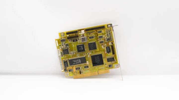 Antique circuit board showcasing vintage computing technology, isolated on a white background.