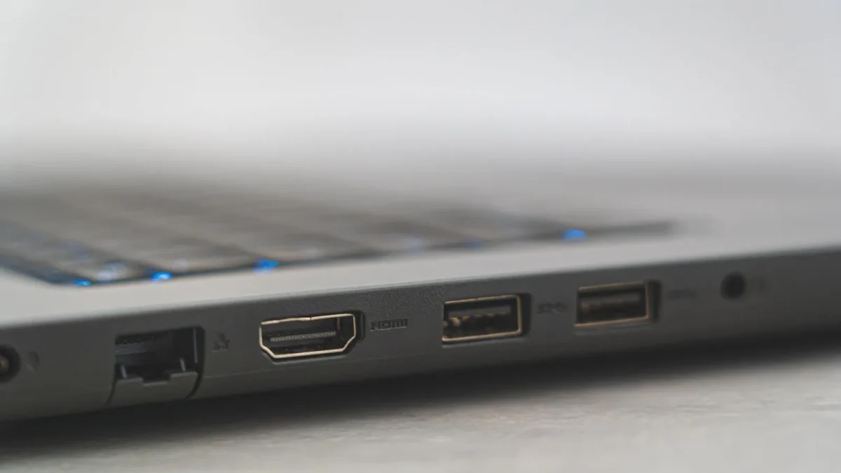 Detailed view of laptop ports including HDMI, USB, and Ethernet, showcasing connectivity options.