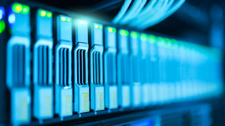 Detailed image of a server rack with glowing lights in a modern data center.