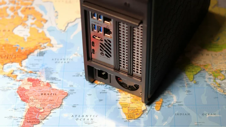 a desktop computer sitting on top of a map