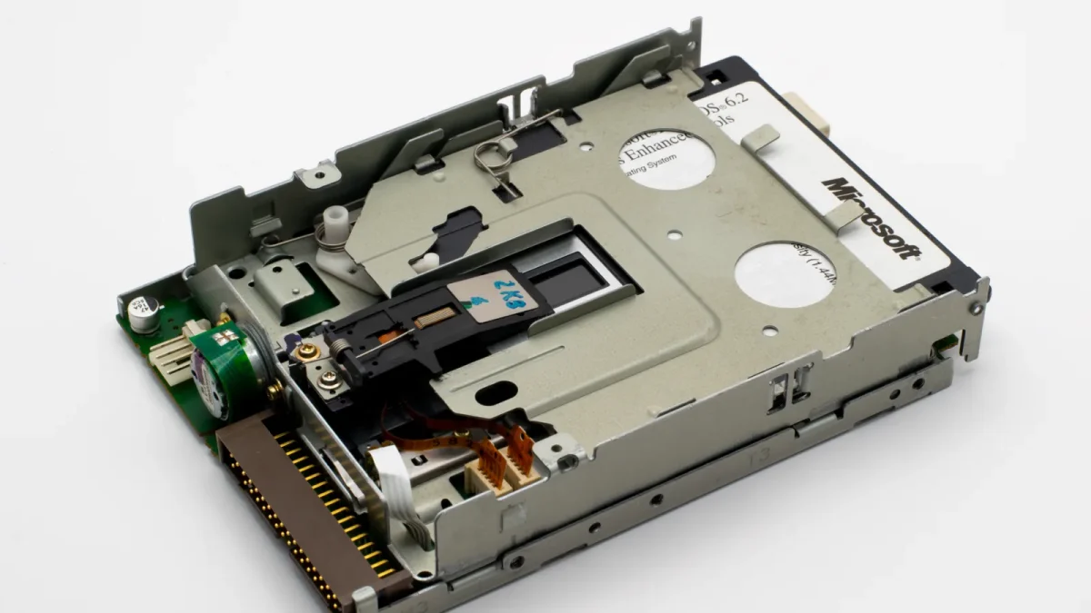 Detailed view of a vintage Microsoft floppy disk drive showcasing retro technology components.